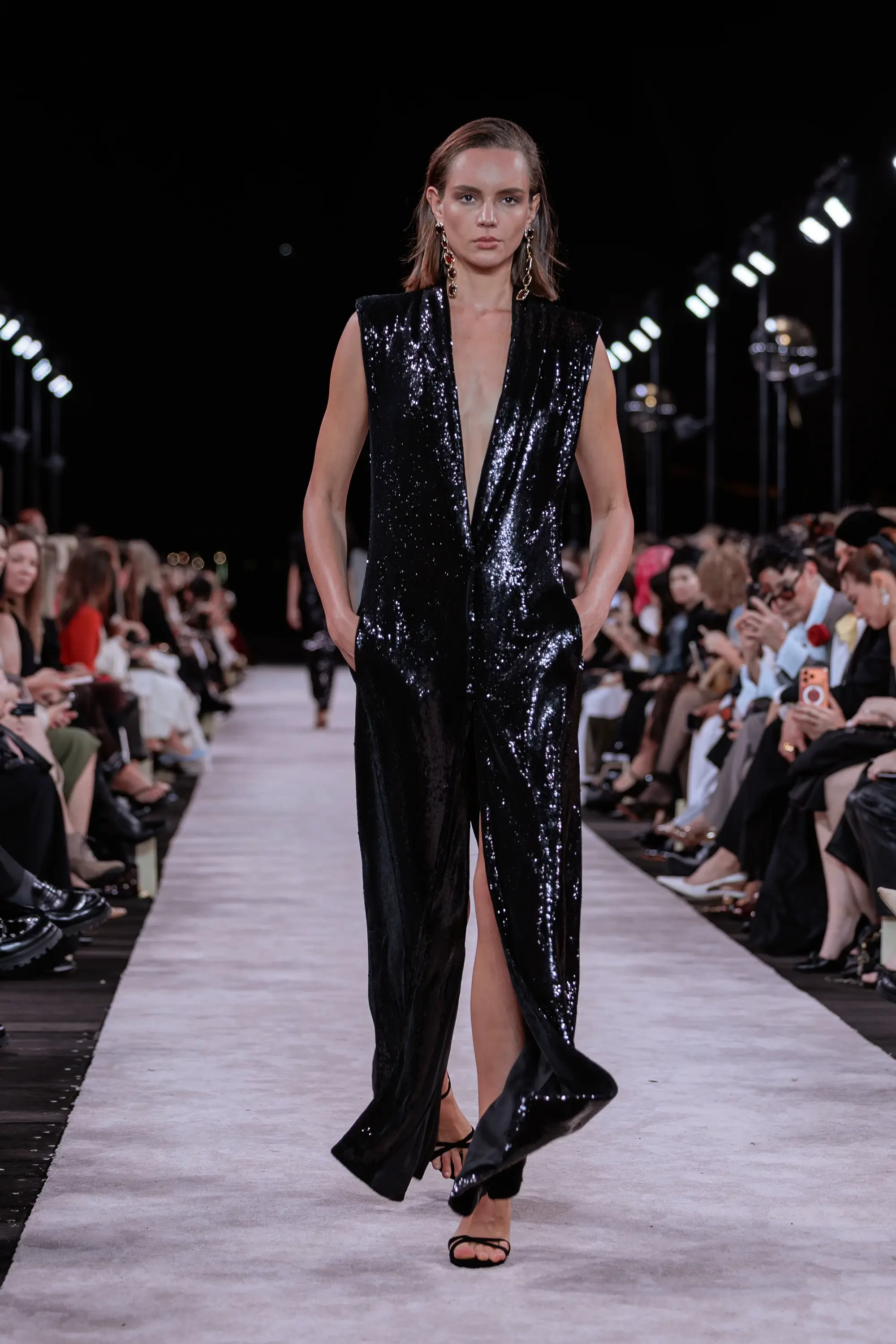 Carla Zampatti ‘Reflections’ runway show photographed at Australian Fashion Week 2026 at the Park Hyatt Sydney Boardwalk, featuring elevated tailoring, fluid silhouettes, shimmering eveningwear and contemporary Australian luxury fashion captured in an editorial runway setting.