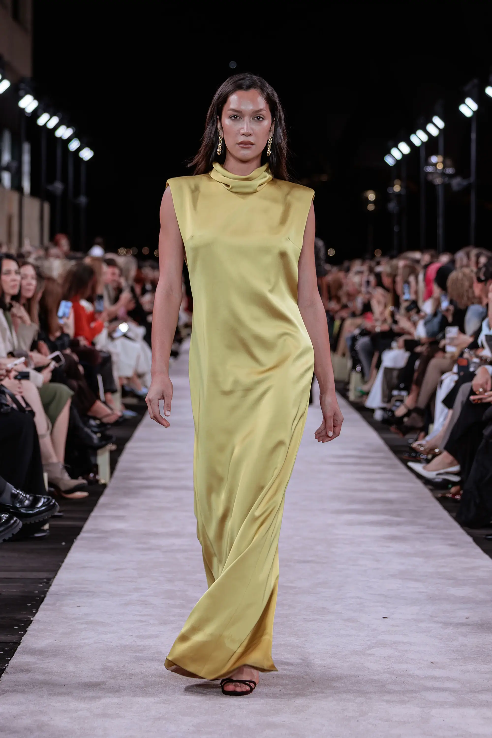 Carla Zampatti ‘Reflections’ runway show photographed at Australian Fashion Week 2026 at the Park Hyatt Sydney Boardwalk, featuring elevated tailoring, fluid silhouettes, shimmering eveningwear and contemporary Australian luxury fashion captured in an editorial runway setting.