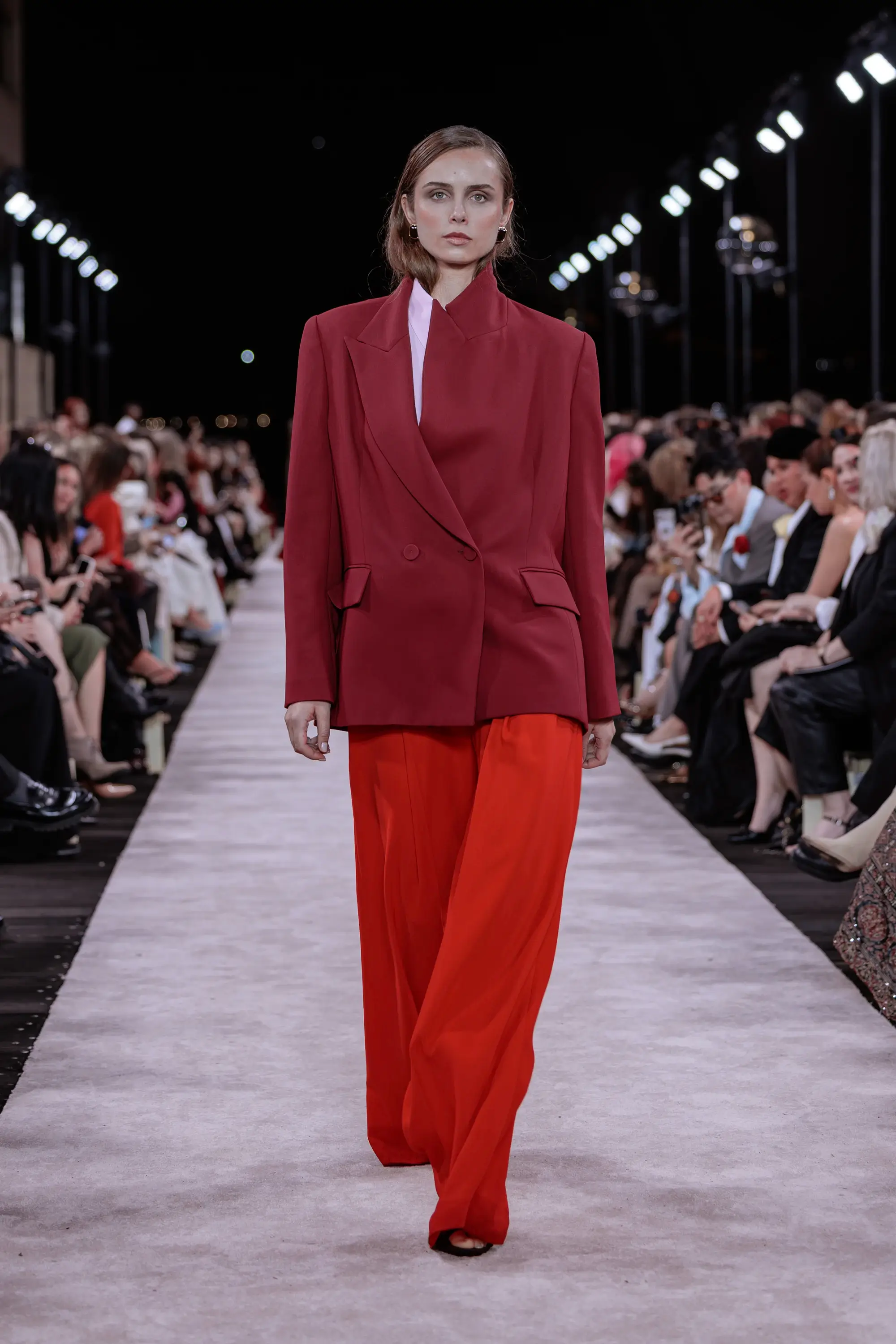 Carla Zampatti ‘Reflections’ runway show photographed at Australian Fashion Week 2026 at the Park Hyatt Sydney Boardwalk, featuring elevated tailoring, fluid silhouettes, shimmering eveningwear and contemporary Australian luxury fashion captured in an editorial runway setting.