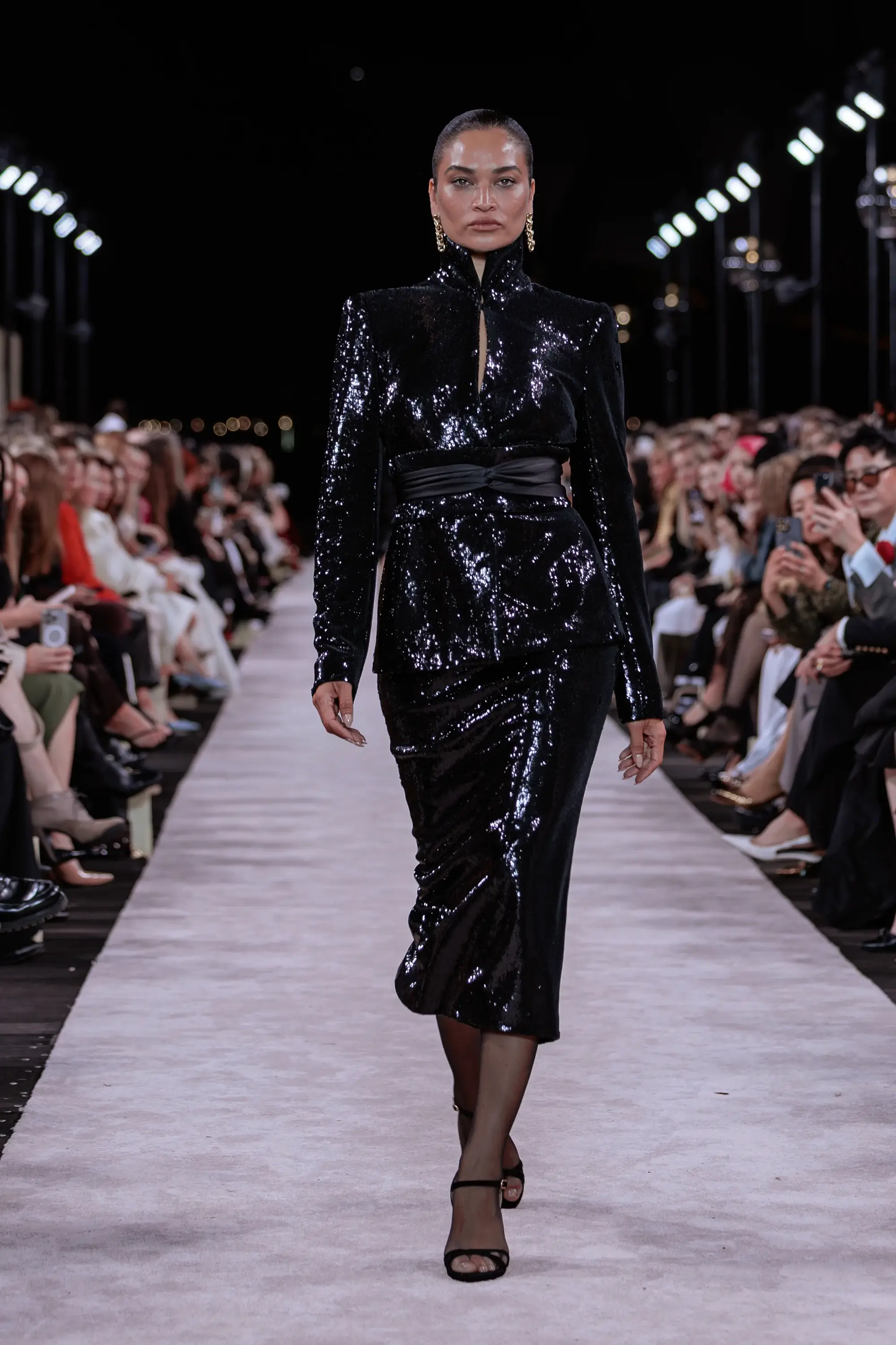Carla Zampatti ‘Reflections’ runway show photographed at Australian Fashion Week 2026 at the Park Hyatt Sydney Boardwalk, featuring elevated tailoring, fluid silhouettes, shimmering eveningwear and contemporary Australian luxury fashion captured in an editorial runway setting.
