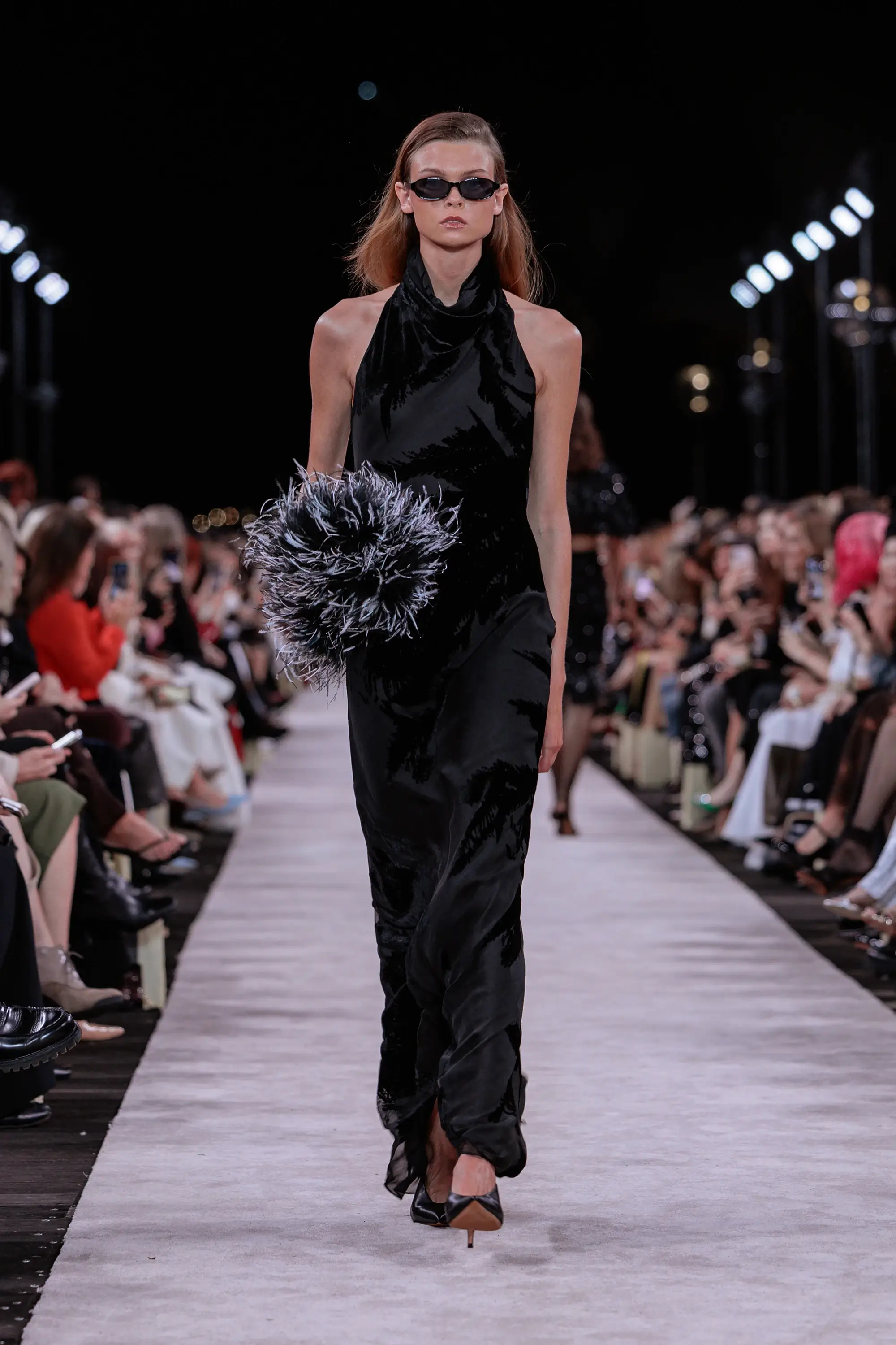 Carla Zampatti ‘Reflections’ runway show photographed at Australian Fashion Week 2026 at the Park Hyatt Sydney Boardwalk, featuring elevated tailoring, fluid silhouettes, shimmering eveningwear and contemporary Australian luxury fashion captured in an editorial runway setting.