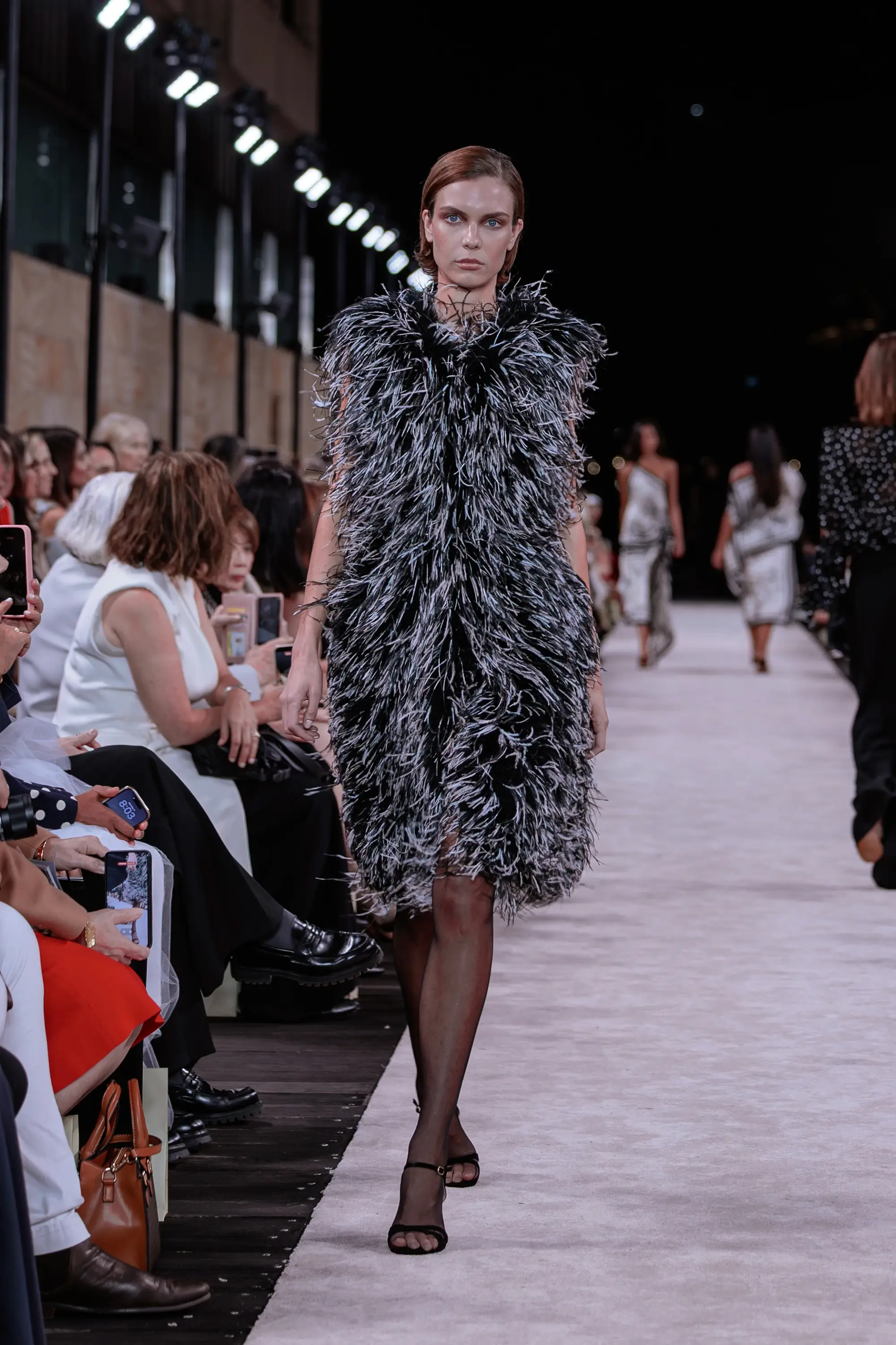 Carla Zampatti ‘Reflections’ runway show photographed at Australian Fashion Week 2026 at the Park Hyatt Sydney Boardwalk, featuring elevated tailoring, fluid silhouettes, shimmering eveningwear and contemporary Australian luxury fashion captured in an editorial runway setting.