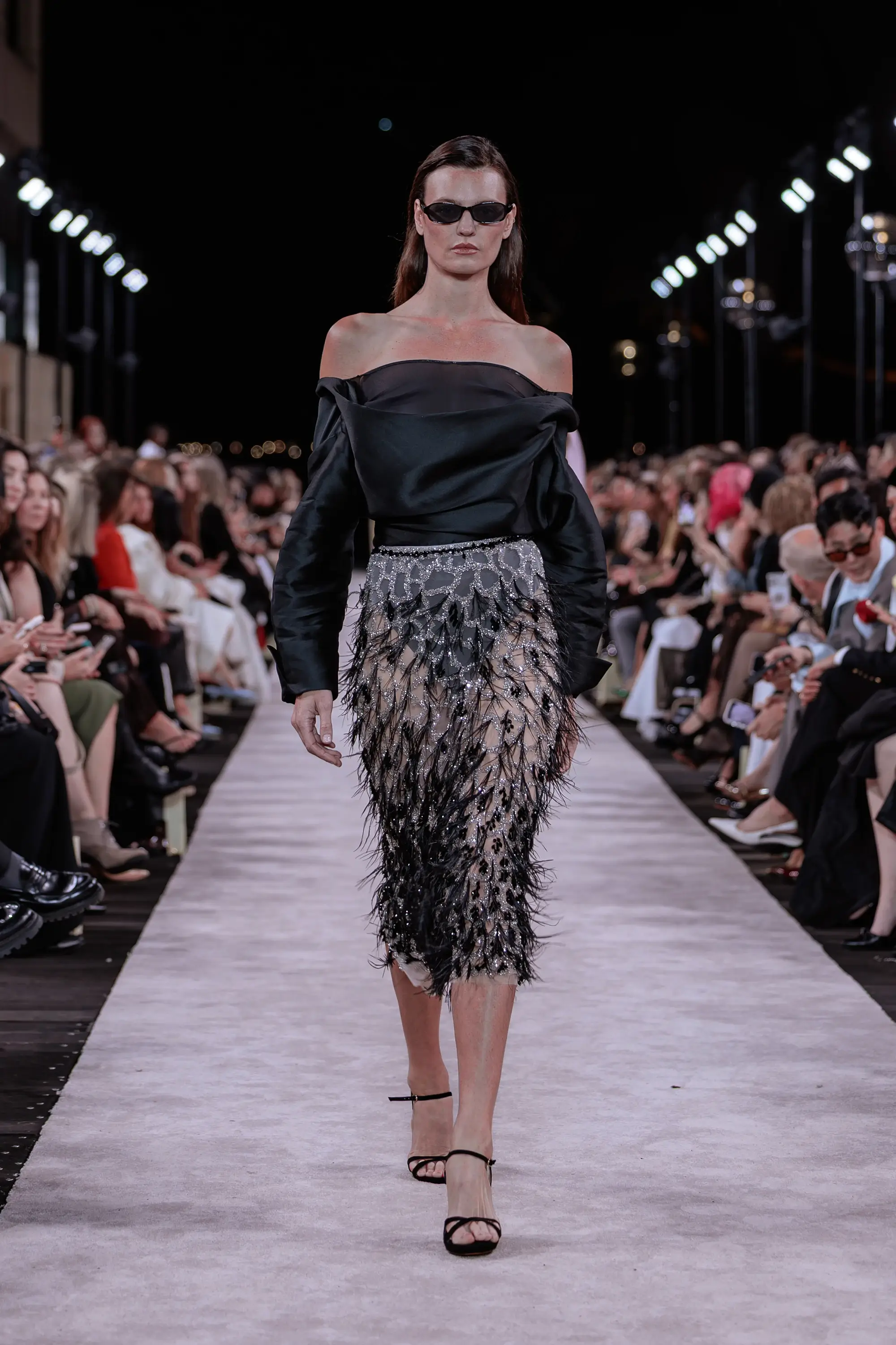 Carla Zampatti ‘Reflections’ runway show photographed at Australian Fashion Week 2026 at the Park Hyatt Sydney Boardwalk, featuring elevated tailoring, fluid silhouettes, shimmering eveningwear and contemporary Australian luxury fashion captured in an editorial runway setting.