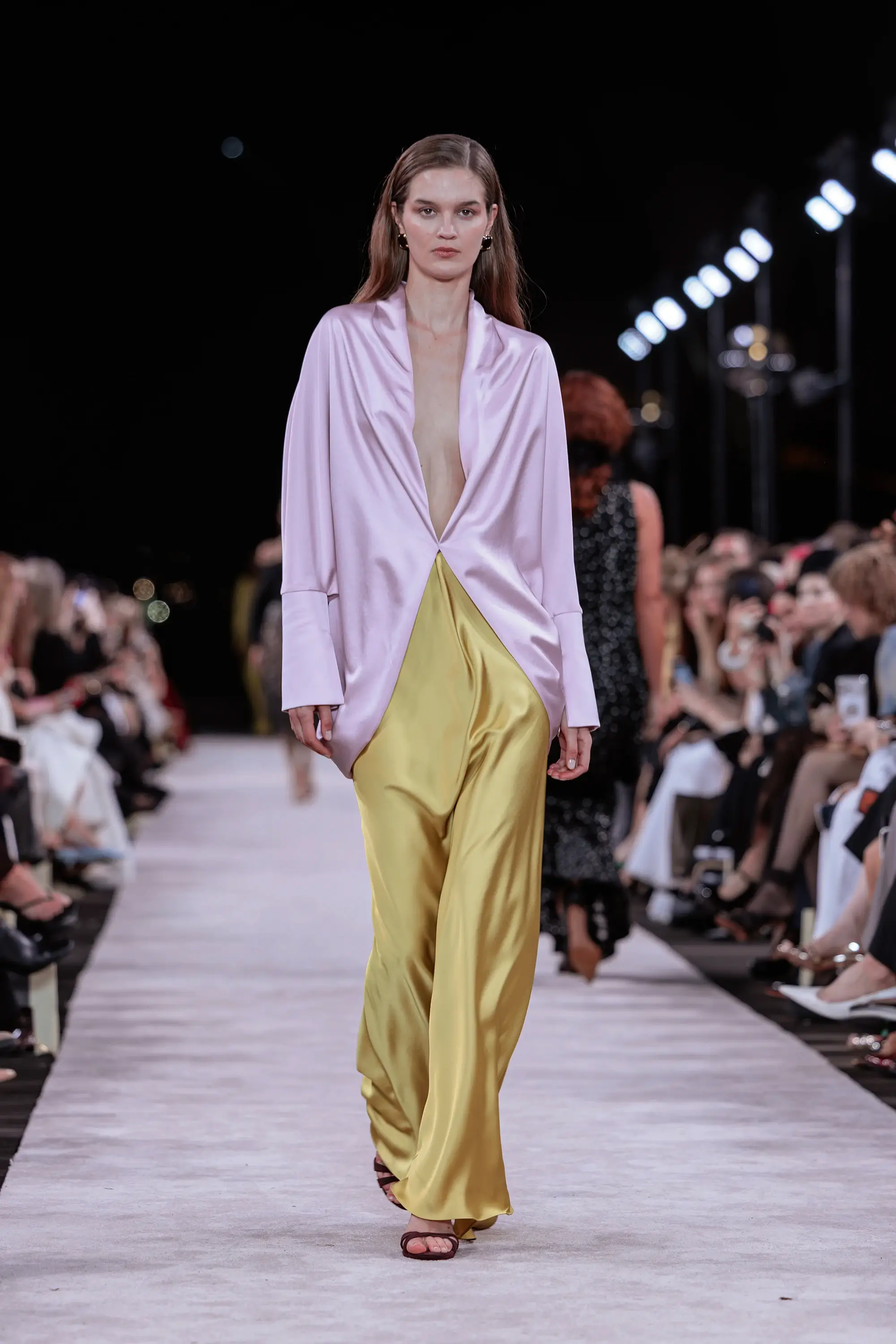 Carla Zampatti ‘Reflections’ runway show photographed at Australian Fashion Week 2026 at the Park Hyatt Sydney Boardwalk, featuring elevated tailoring, fluid silhouettes, shimmering eveningwear and contemporary Australian luxury fashion captured in an editorial runway setting.