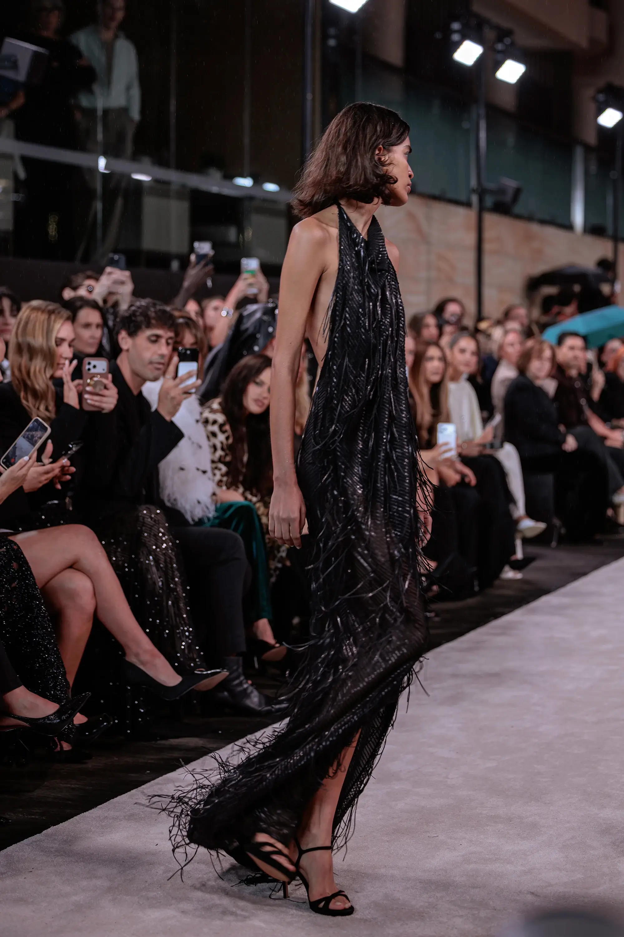 Carla Zampatti ‘Reflections’ runway show photographed at Australian Fashion Week 2026 at the Park Hyatt Sydney Boardwalk, featuring elevated tailoring, fluid silhouettes, shimmering eveningwear and contemporary Australian luxury fashion captured in an editorial runway setting.
