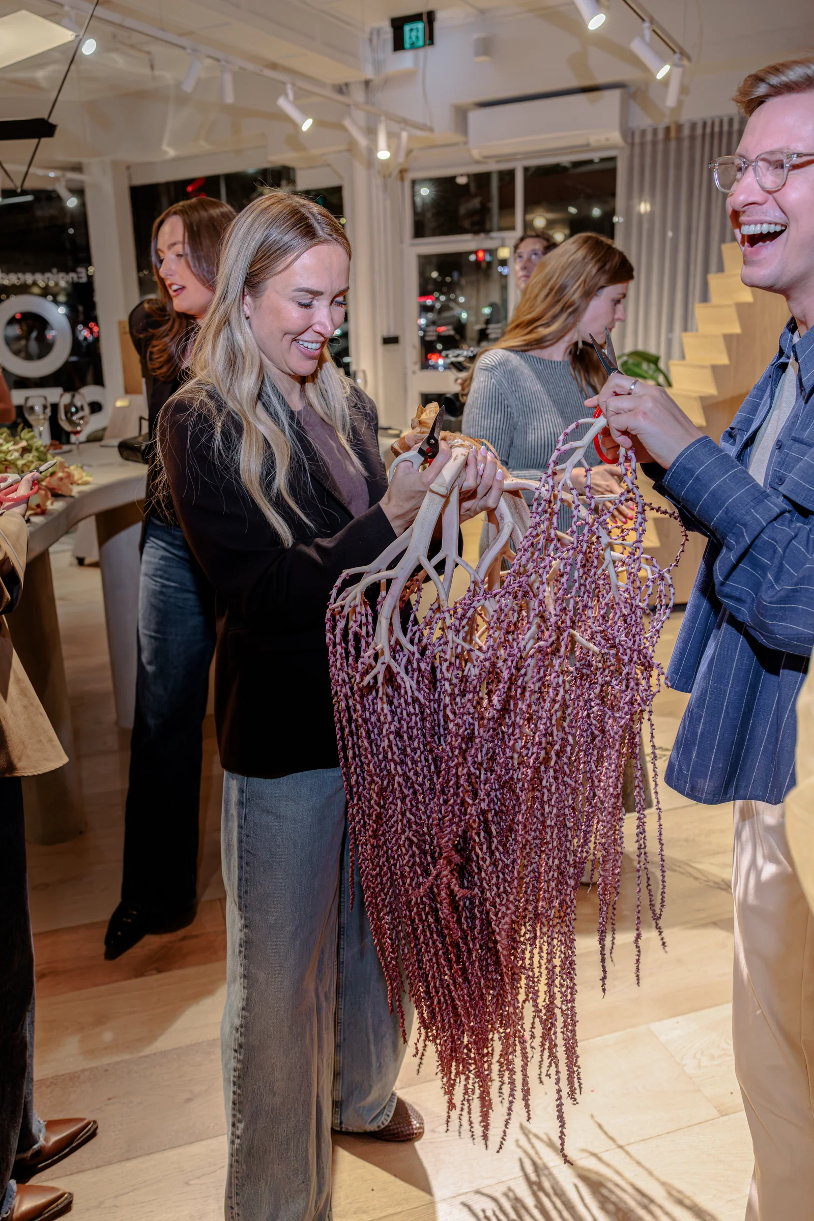 Two guests choosing trailing flowers during the September Studio workshop, photographed by EDG Studios.