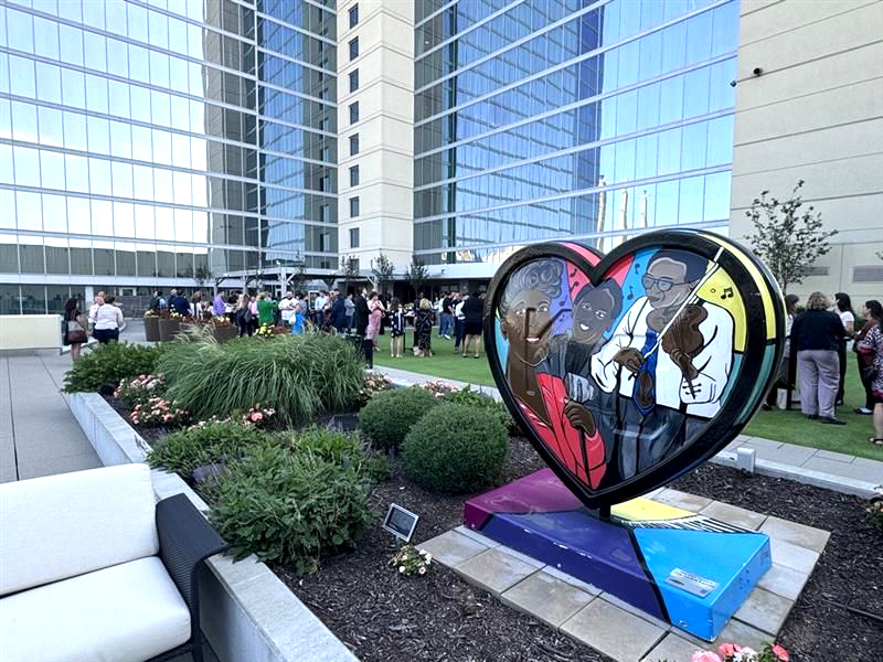 KC Chamber event photo featuring KC Heart artwork and anonymous event guests in background 