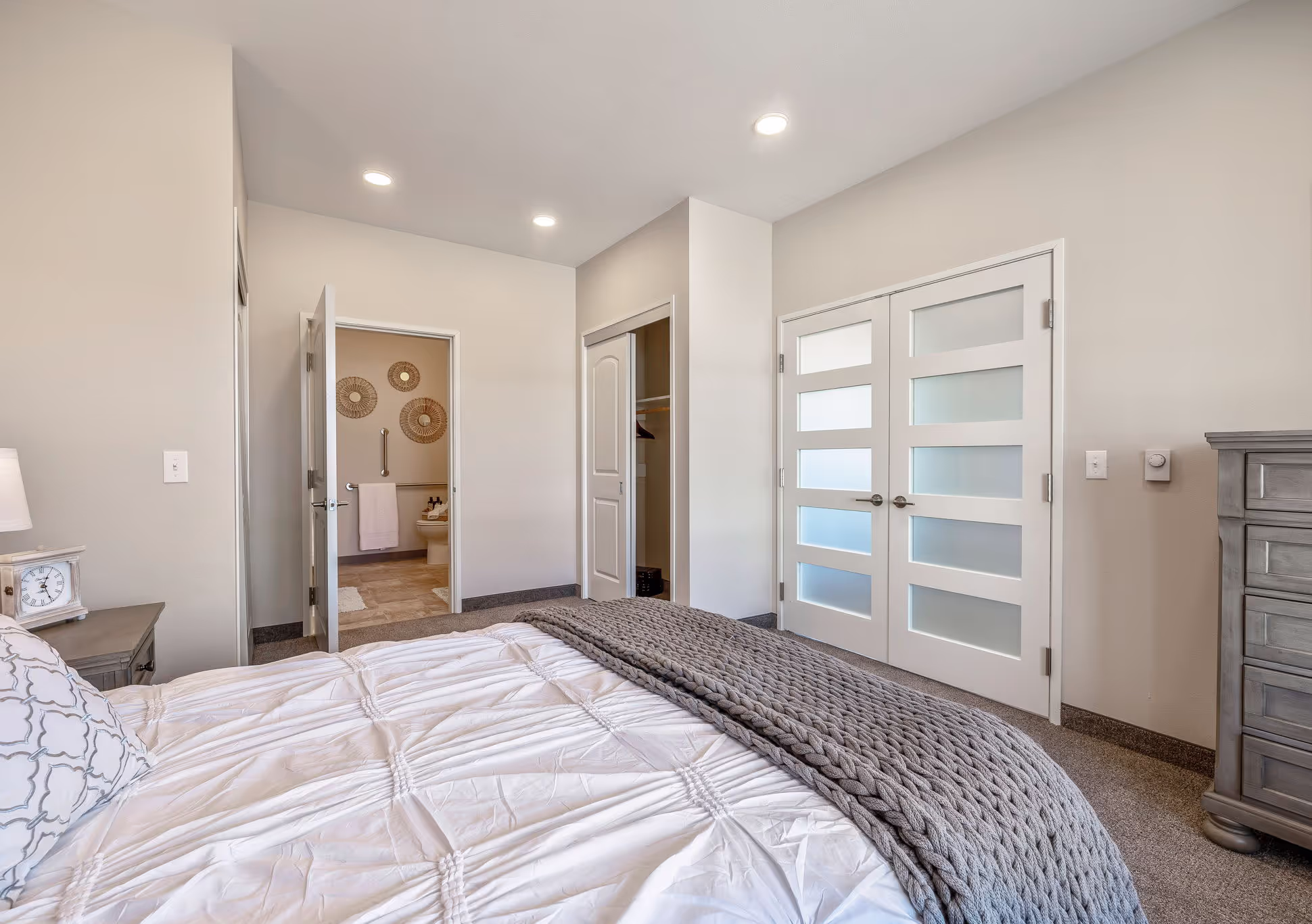  bedroom with a bed, dresser and closet