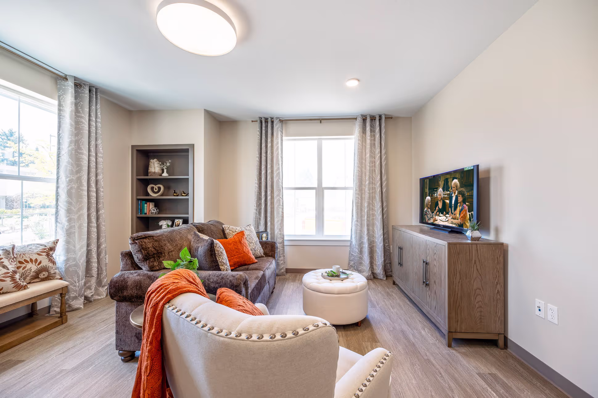 A living room with a tv and a couch