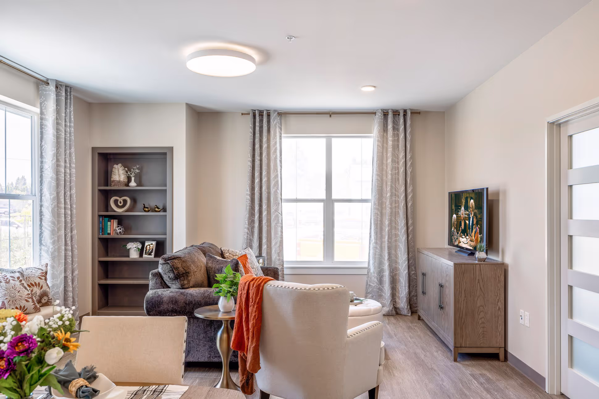 A living room with a tv and a couch