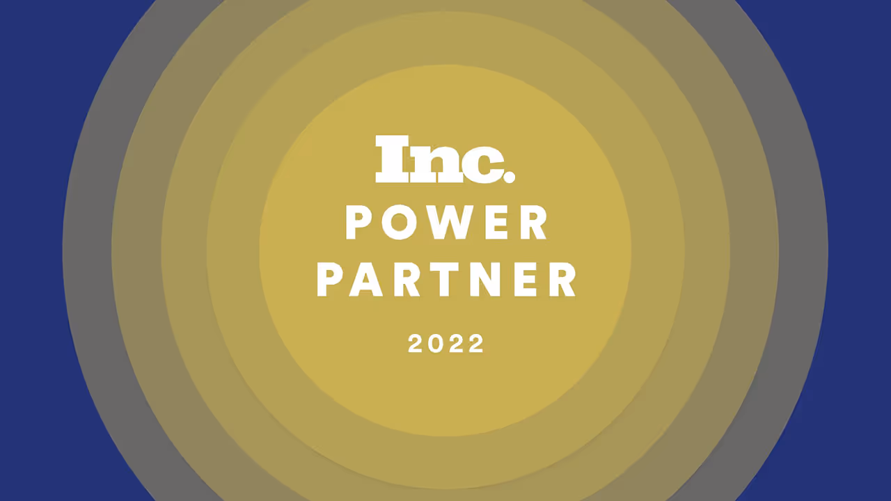 Concentric circles of gold color on a field of purple, with the Inc. Power Partner logo in the center.