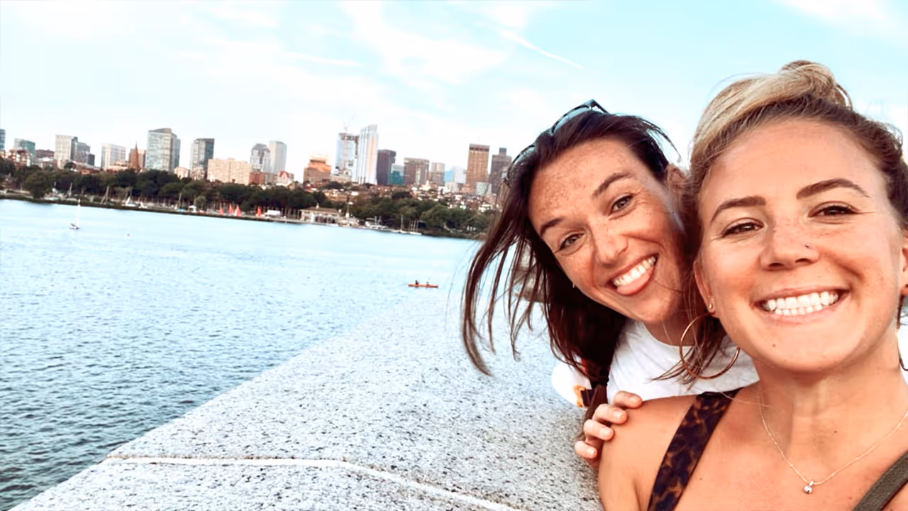 A photo of two people near a body of water; one of those people is Taylor Pratt-Houle