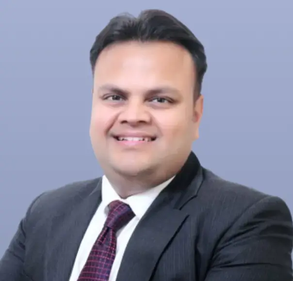 Archit Garg, a man with short black hair in a dark suit.