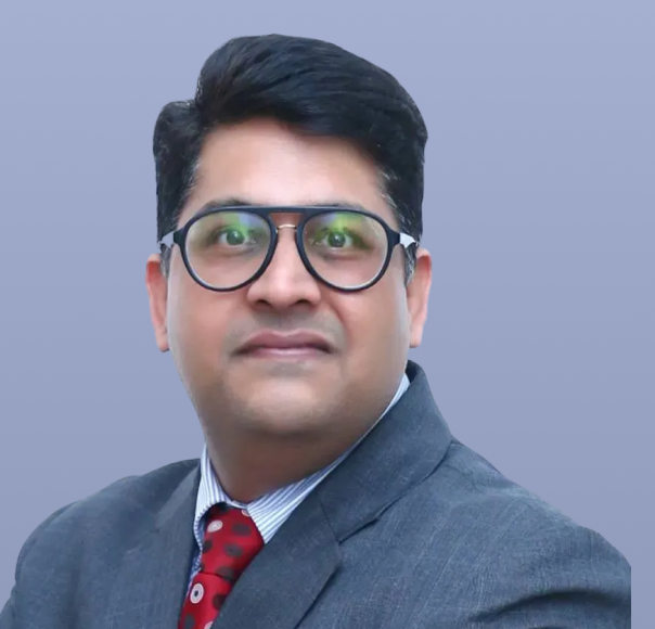 Sumegh Bhatia, a man in a dark suit and tie, is pictured.