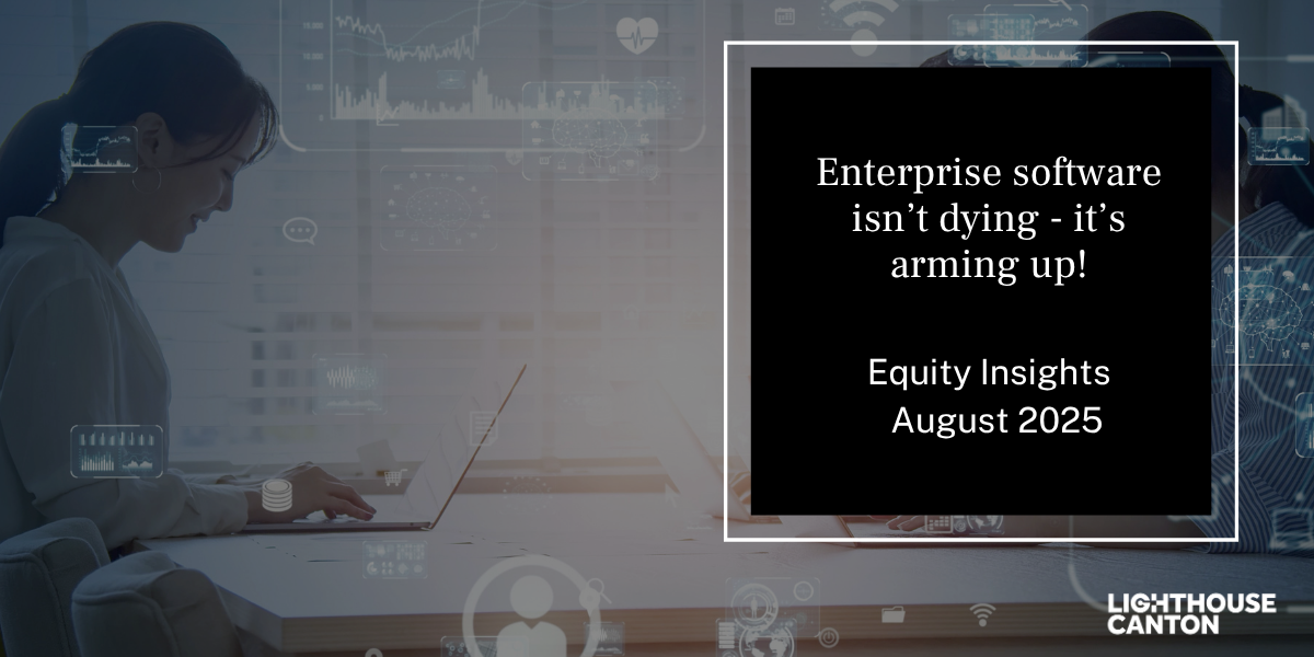 Woman at computer displaying a digital graph titled "Enterprise software isn’t dying - it’s arming up!".