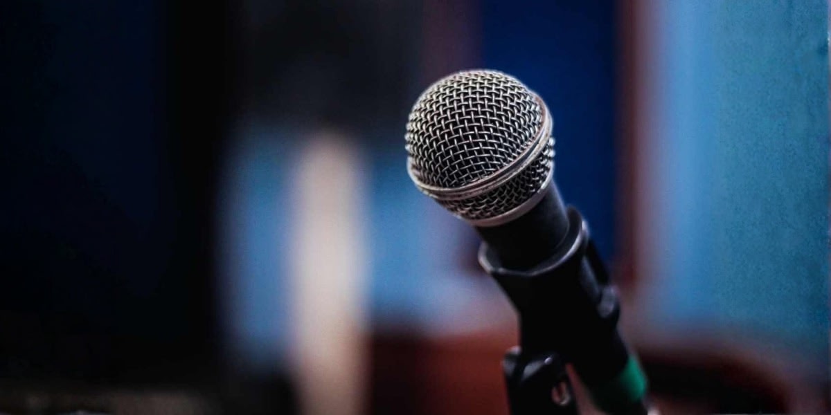 Joydeb Chatterjee’s microphone in the background.