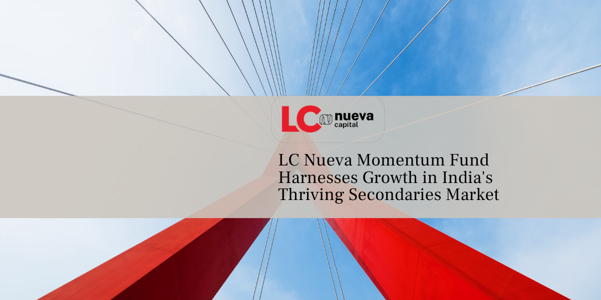 Red bridge cables against a blue sky.