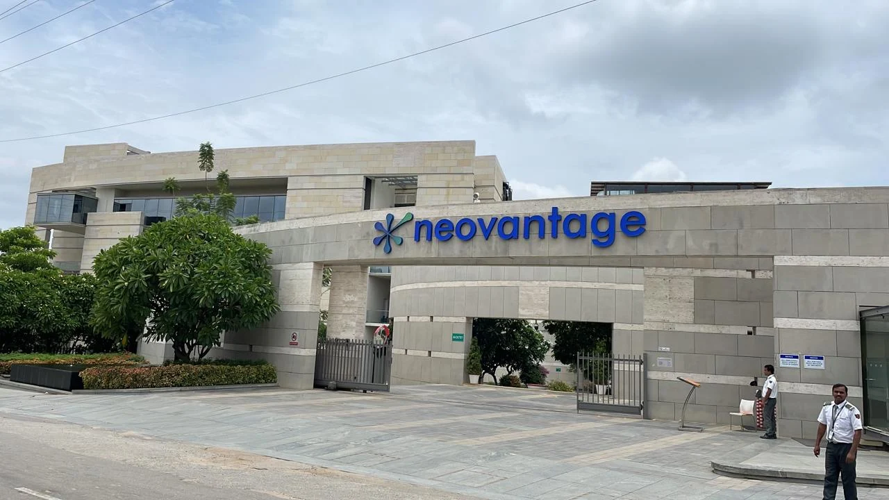Neovantage building exterior with entrance and security personnel.