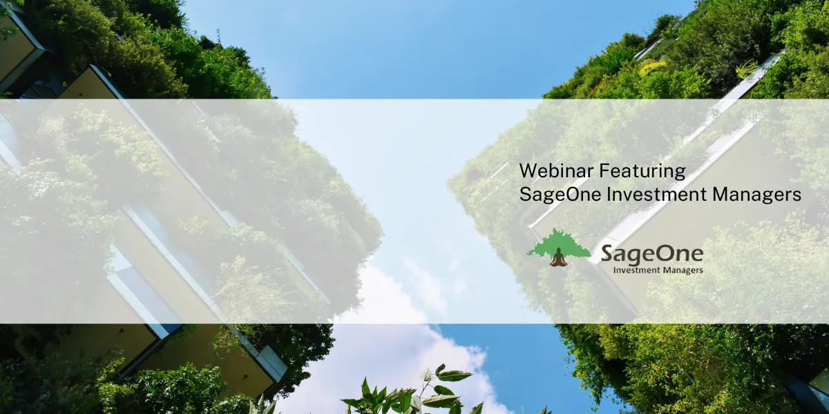 Urban buildings under a blue sky.