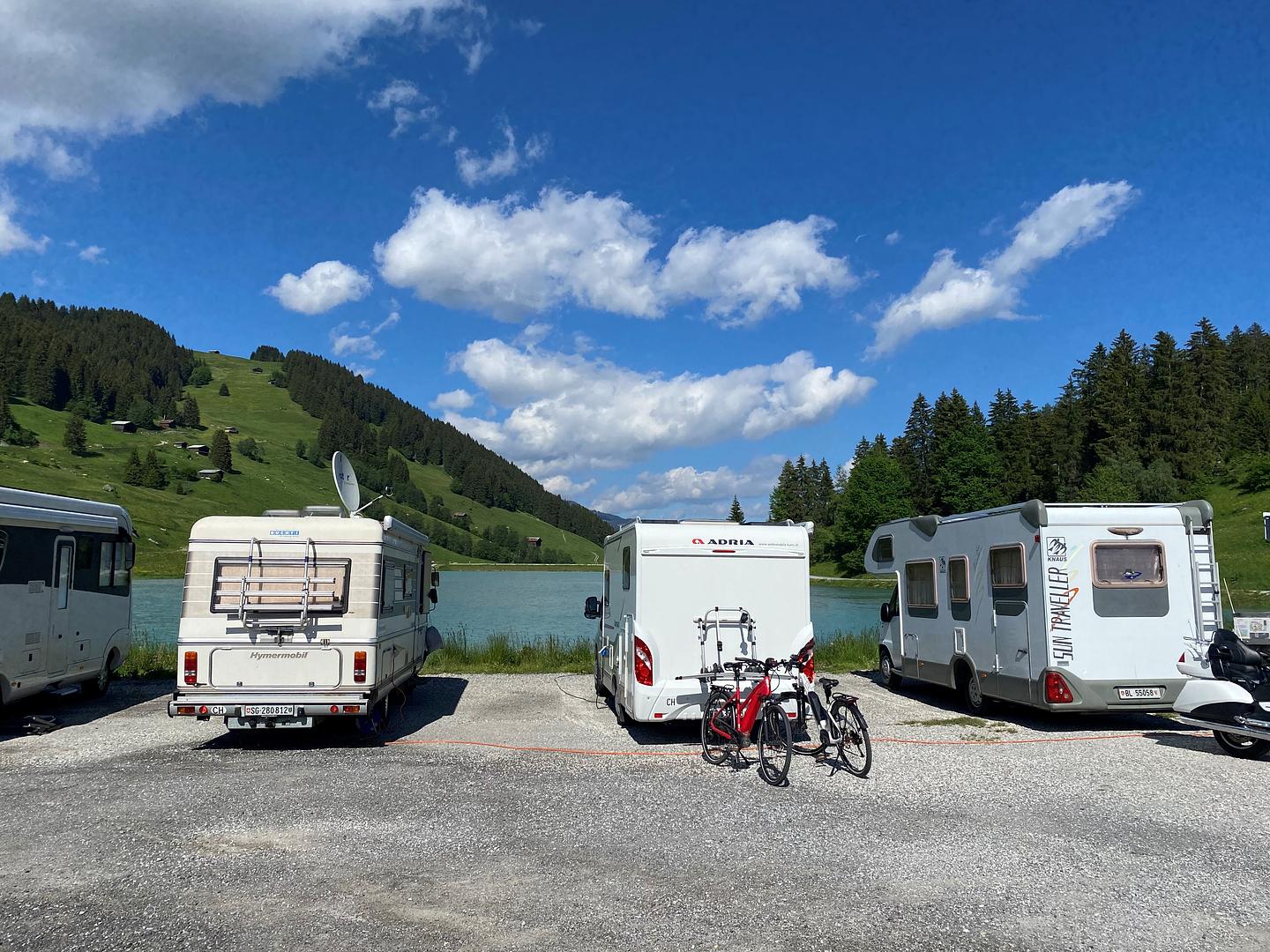 Motorhomes at the Brigels lakeside pitch