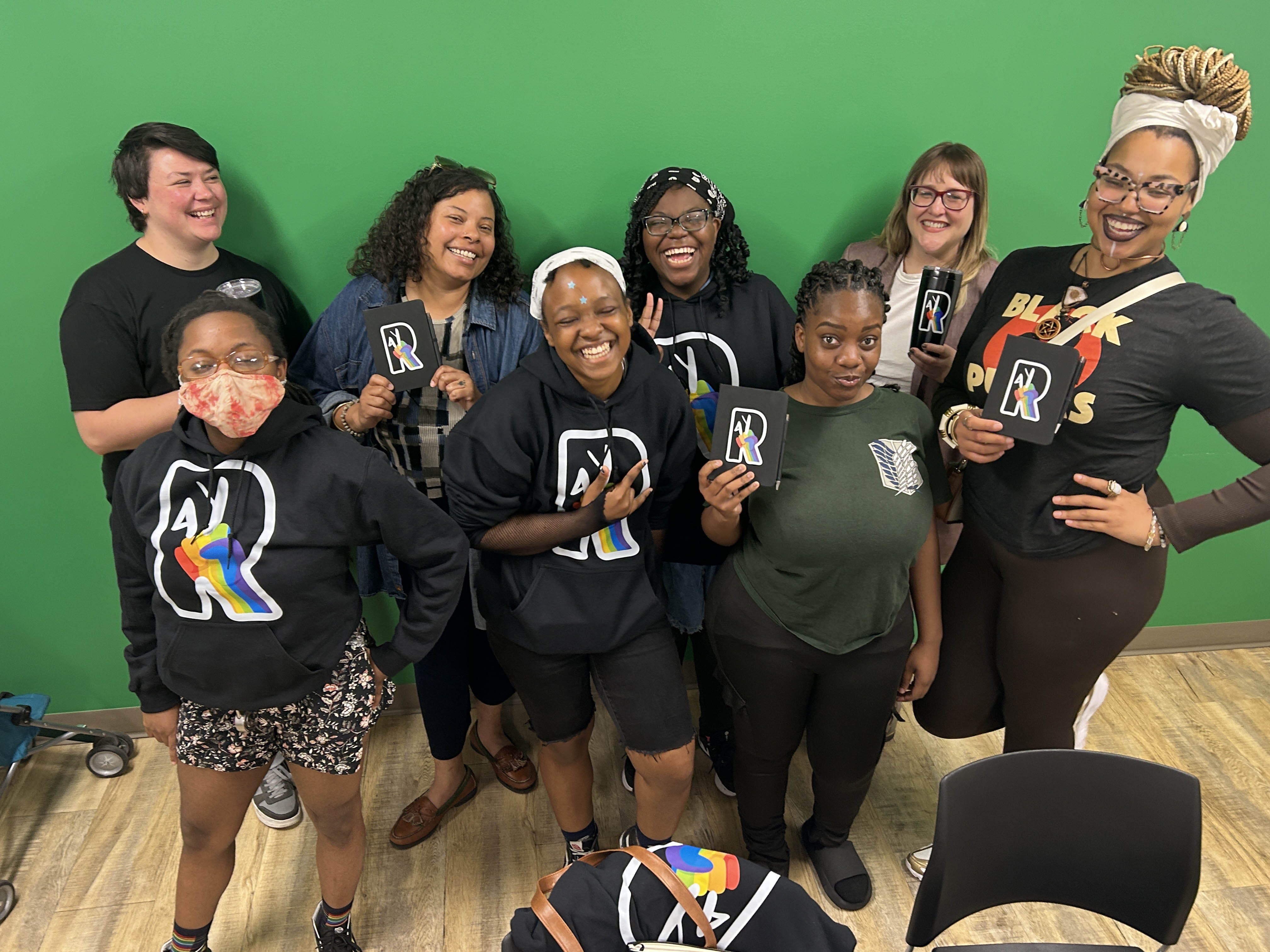 Two young women looking at phone and laughing