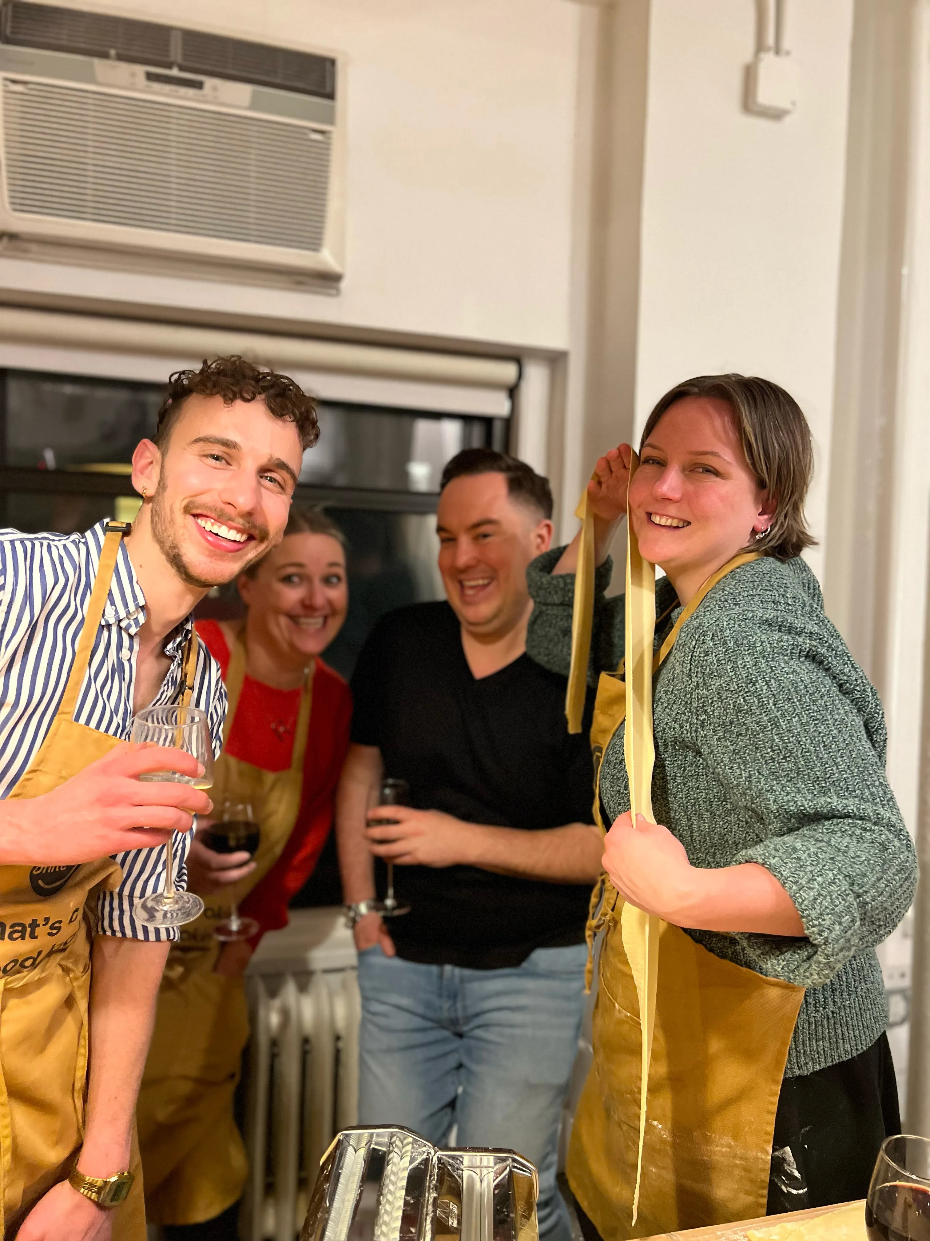 Team cooking together in a hands-on team-building class in New York City