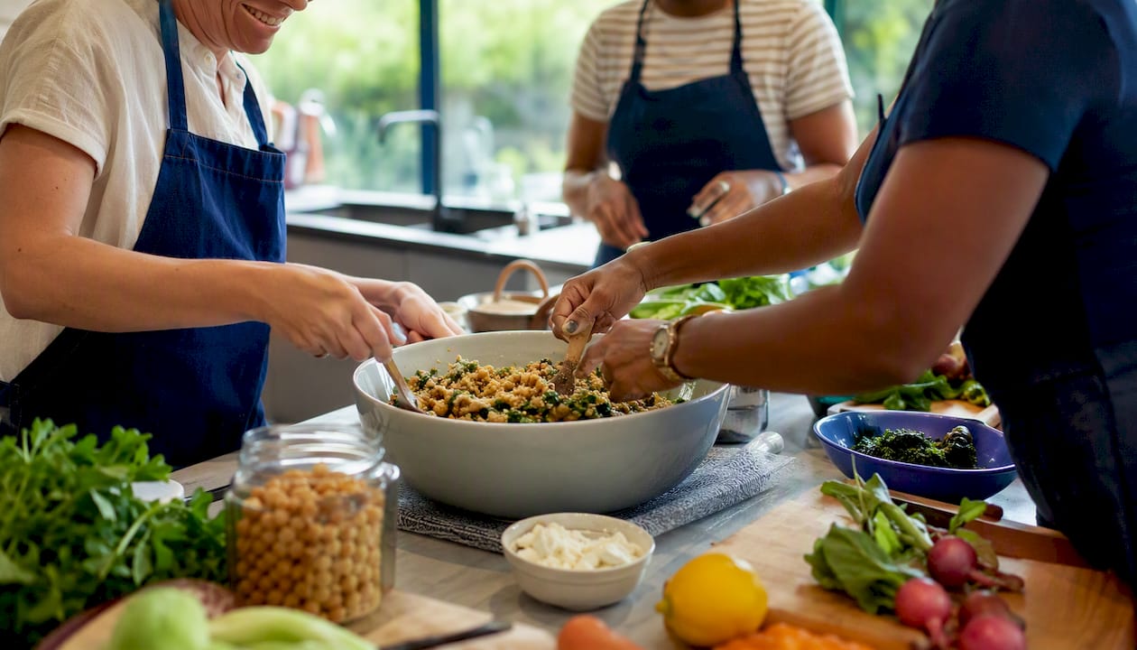 Hands using adaptive utensils in culinary workshop