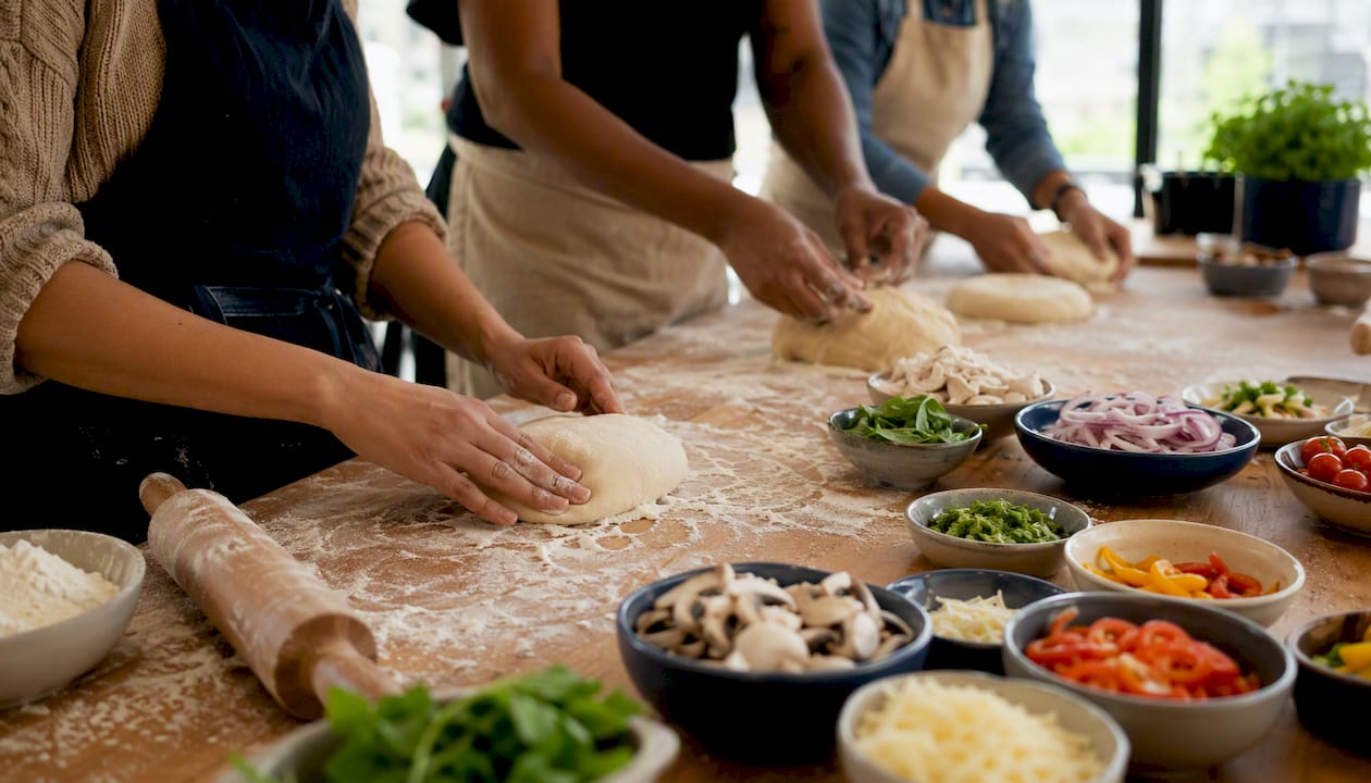 Hands stirring and chopping in group cooking class