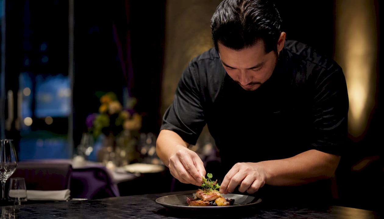 Chef plating dish at private dinner event