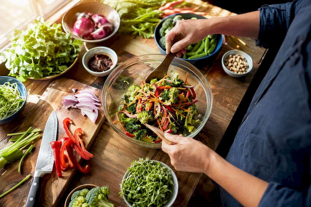 Chef hands whisking ingredients in kitchen