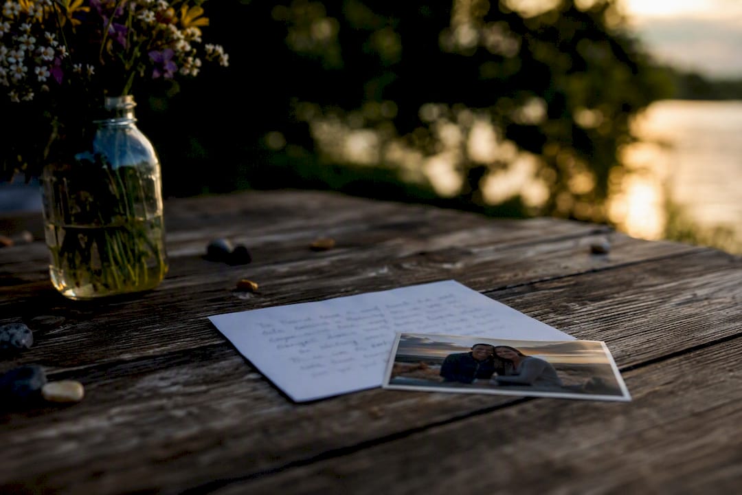 Handwritten note and photo on wooden table
