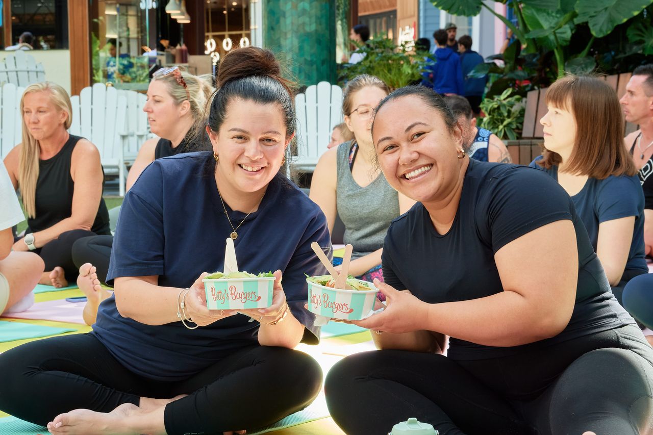 Guests eating Betty’s Bowls on Pilates mats at Westfield Chermside