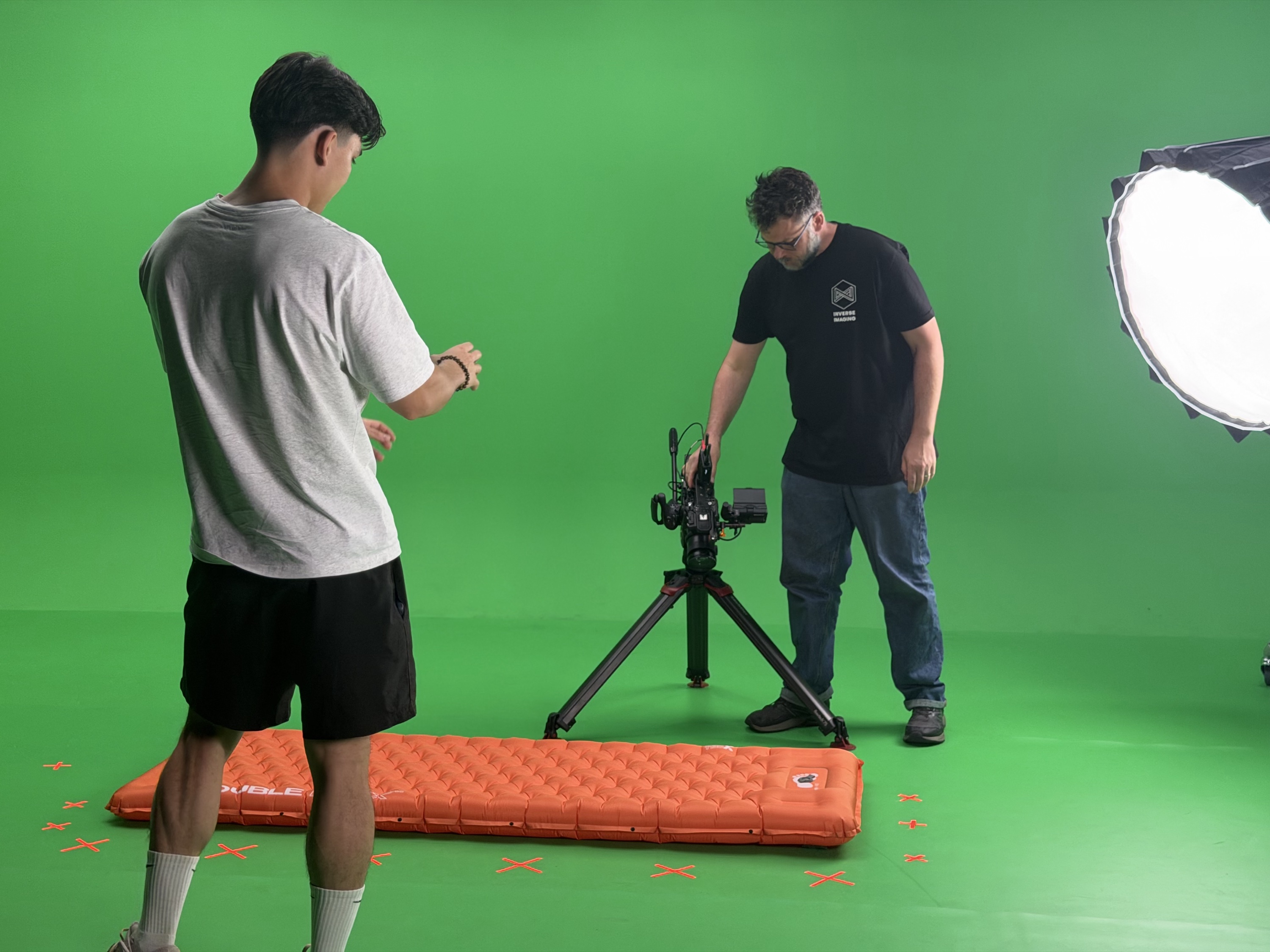 Crew setting up a Barkers Rocks mat shot on the green screen