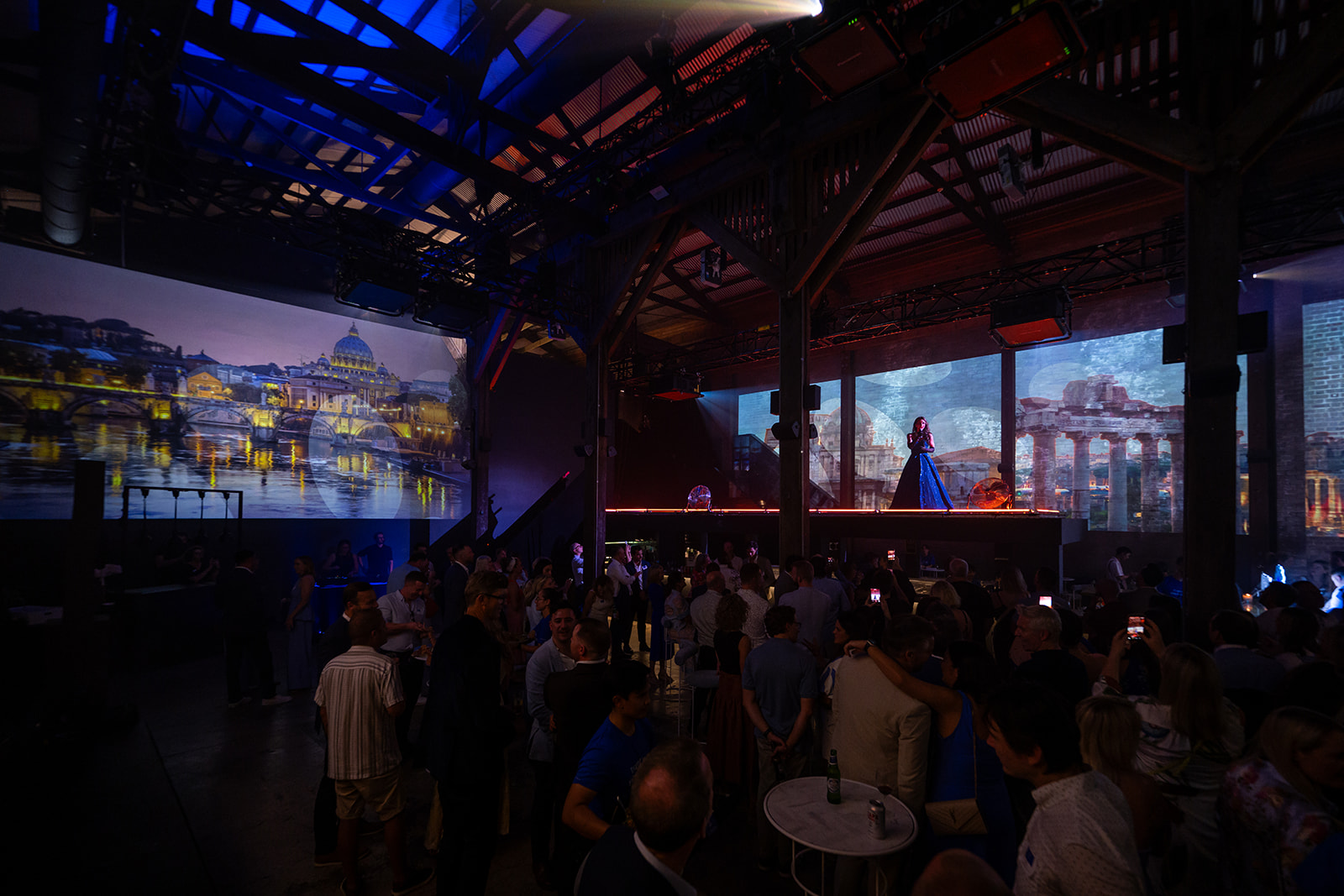Guests surrounded by projected European landmarks at the World360 launch