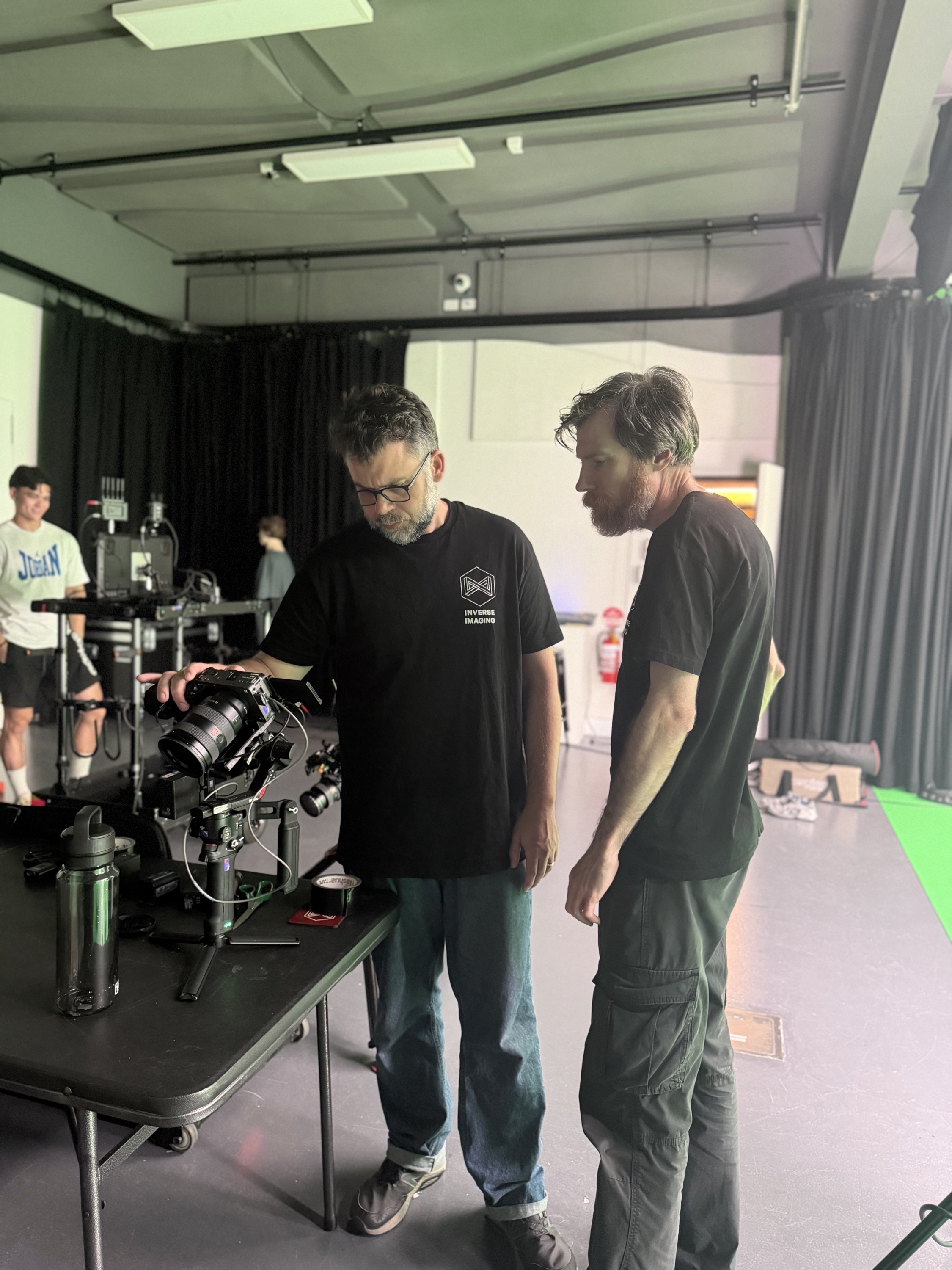 Crew checking camera gear in the Inverse Imaging studio