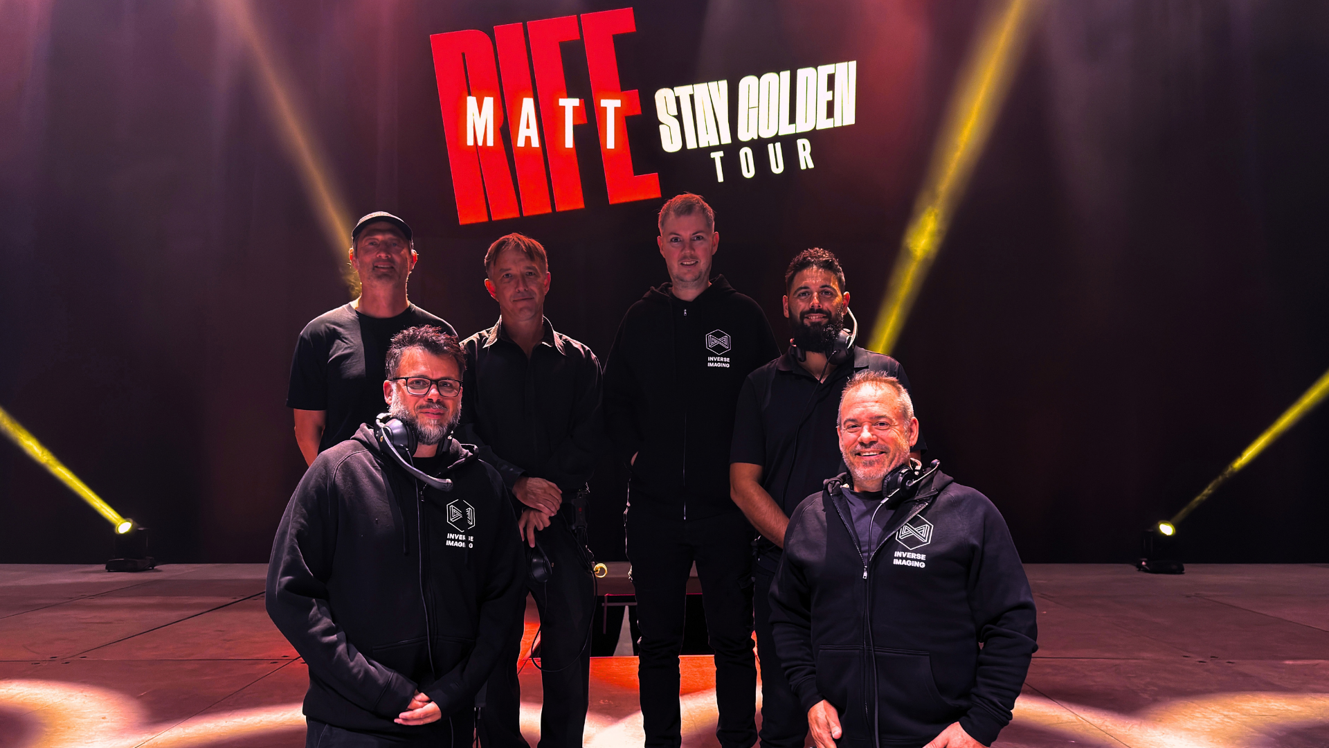 Inverse Imaging crew on stage in front of the Matt Rife Stay Golden Tour backdrop