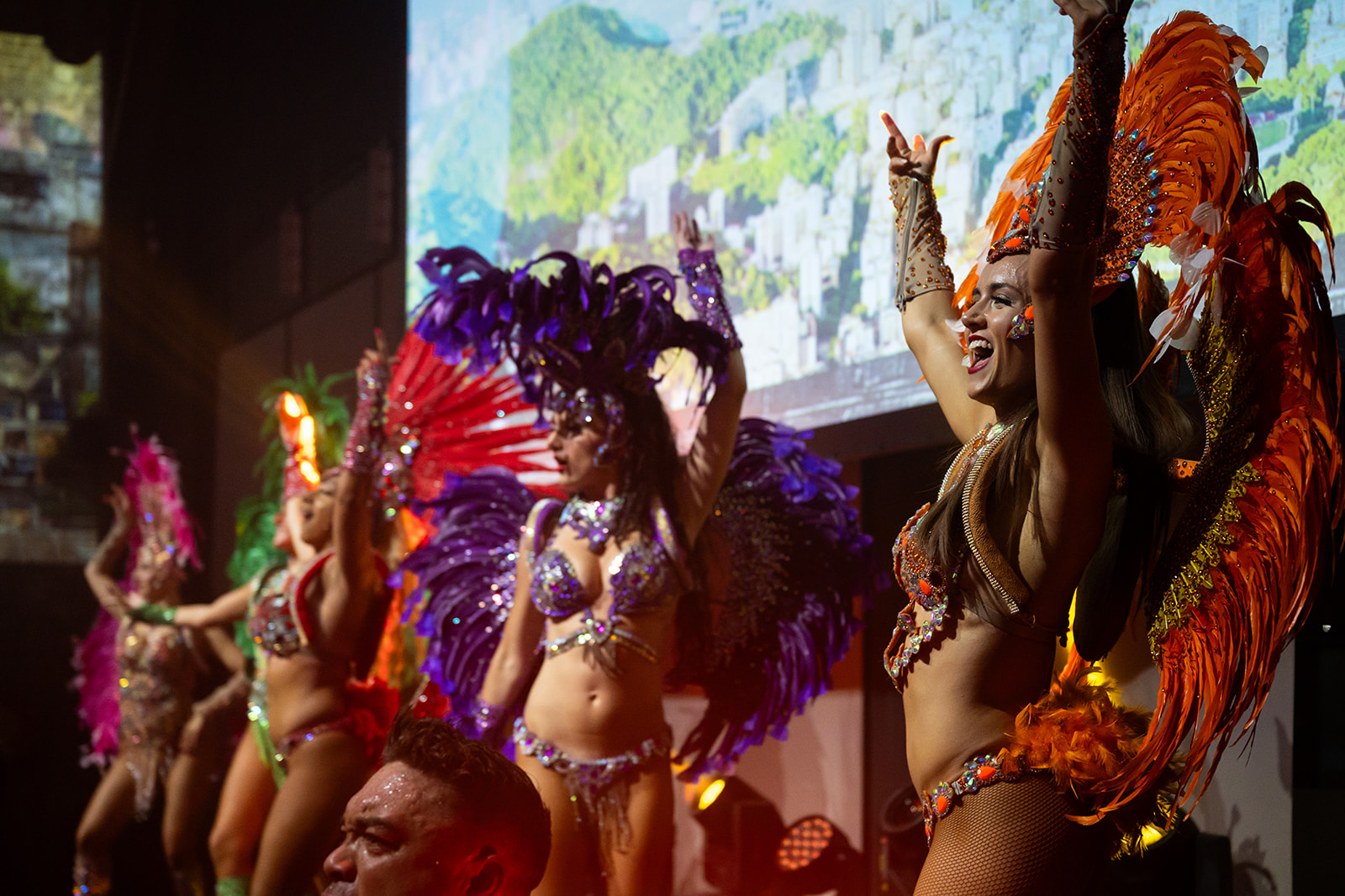 Samba dancers in feathered costumes at the World360 launch