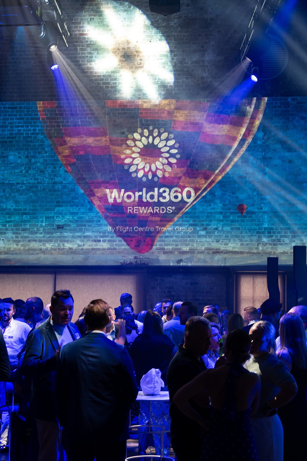 World360 Rewards logo projected above the crowd
