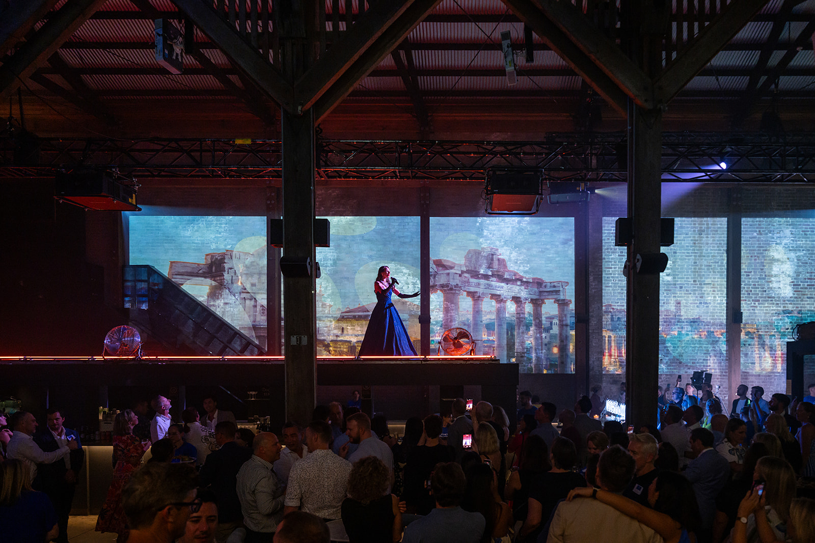 Singer performing to a full room at the World360 Rewards launch
