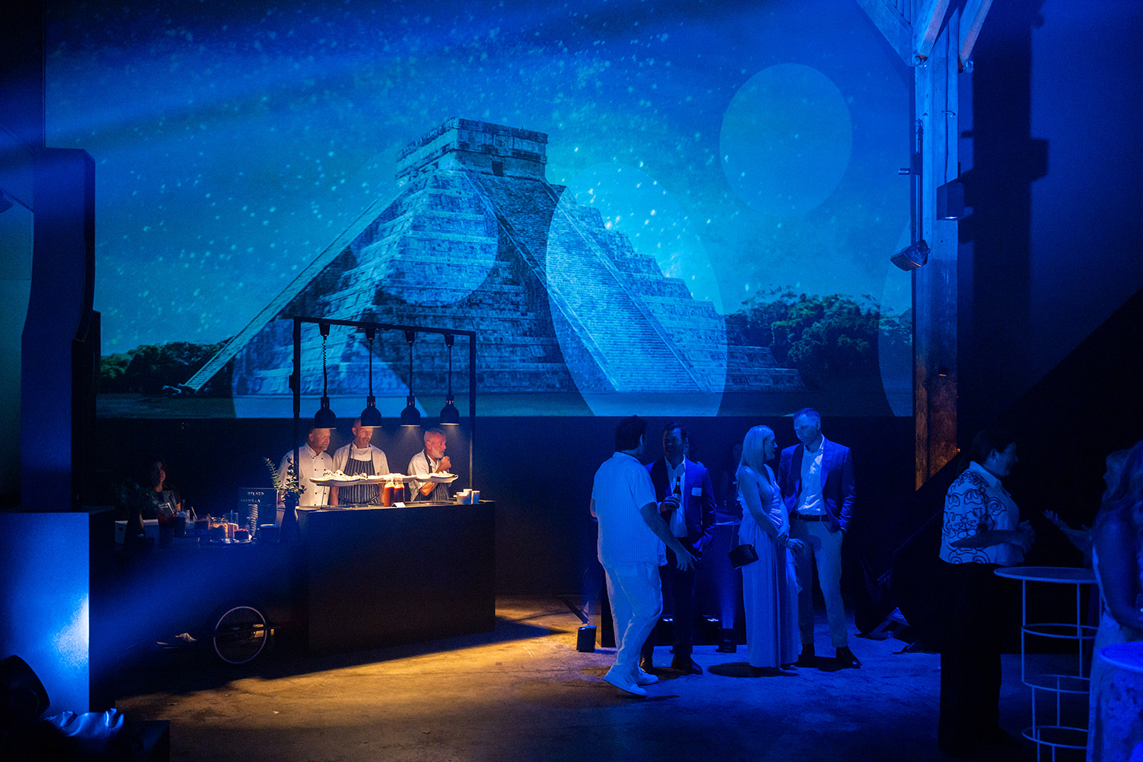 Mayan pyramid projection above a food station