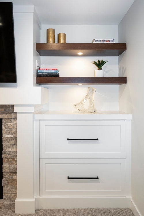 Detail of one side of an entertainment unit with under shelf lighting.