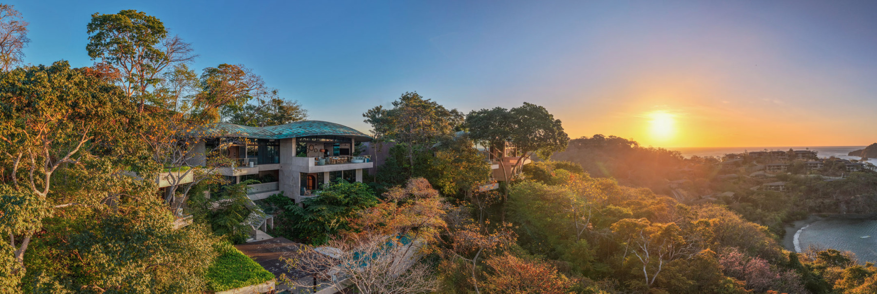 Costa Rica Cliffside home above the forest at sunset