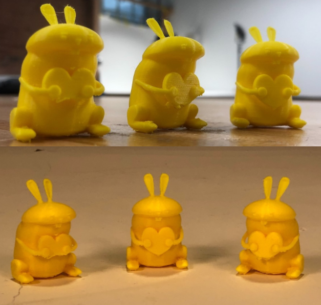 2 pictures of three printed bunnies holding a heart with different lighting set up