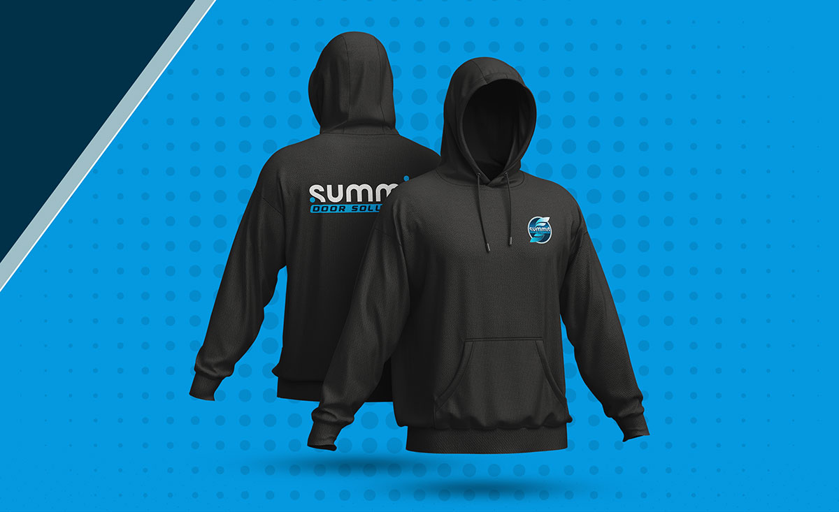Custom branded apparel for Summit Door Solutions as part of a complete commercial branding system.