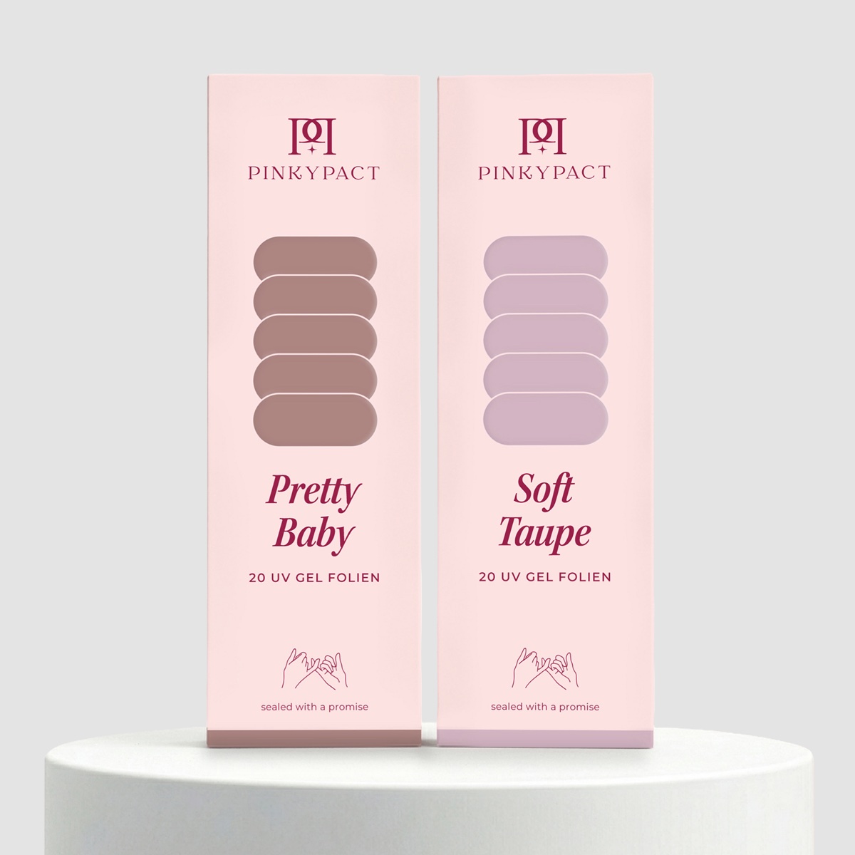 Two PINKYPACT UV gel wrap packs on a pedestal