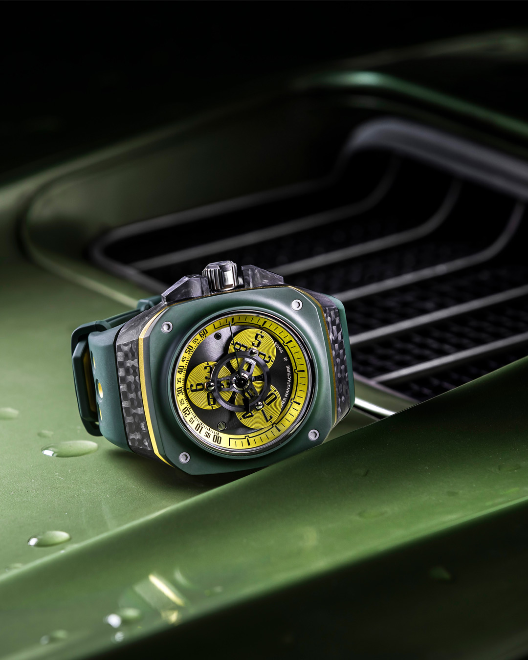 Gorilla watch with a yellow dial on a green car grille
