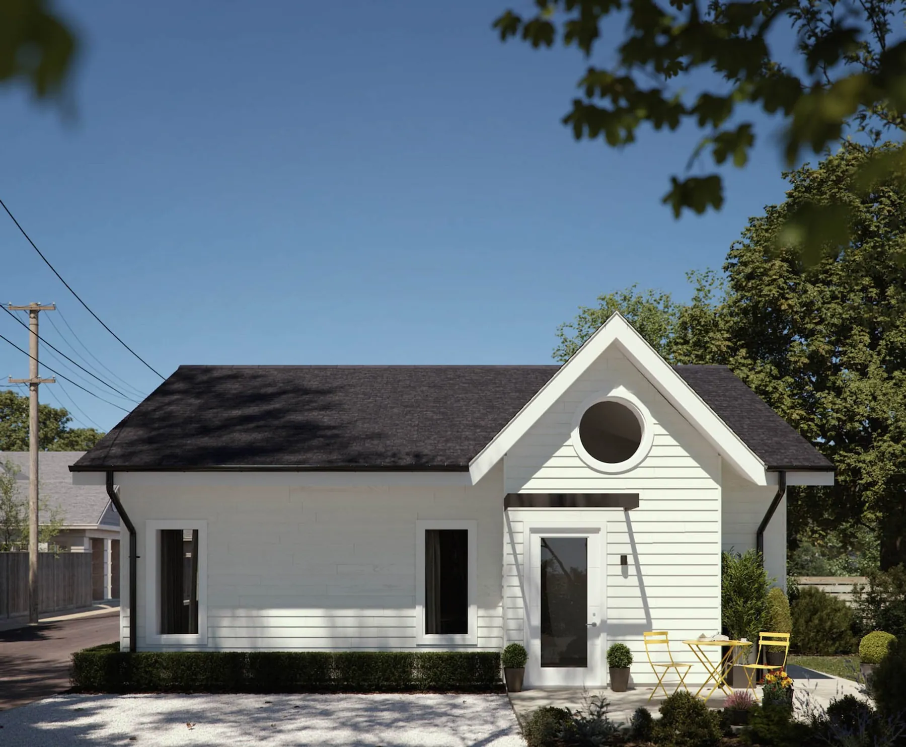 White laneway cottage with a round window by Smallworks