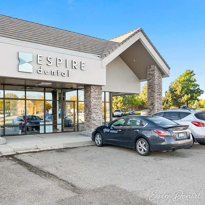 Espire Dental office storefront with a parking lot