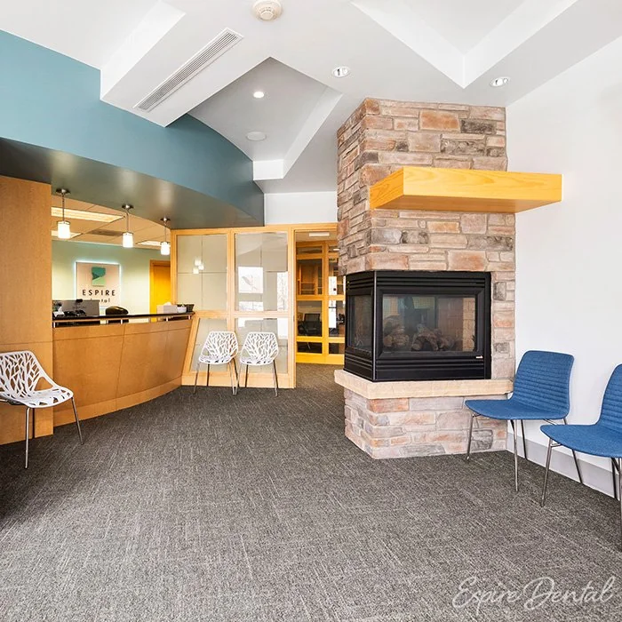 Espire Dental waiting area with a stone fireplace