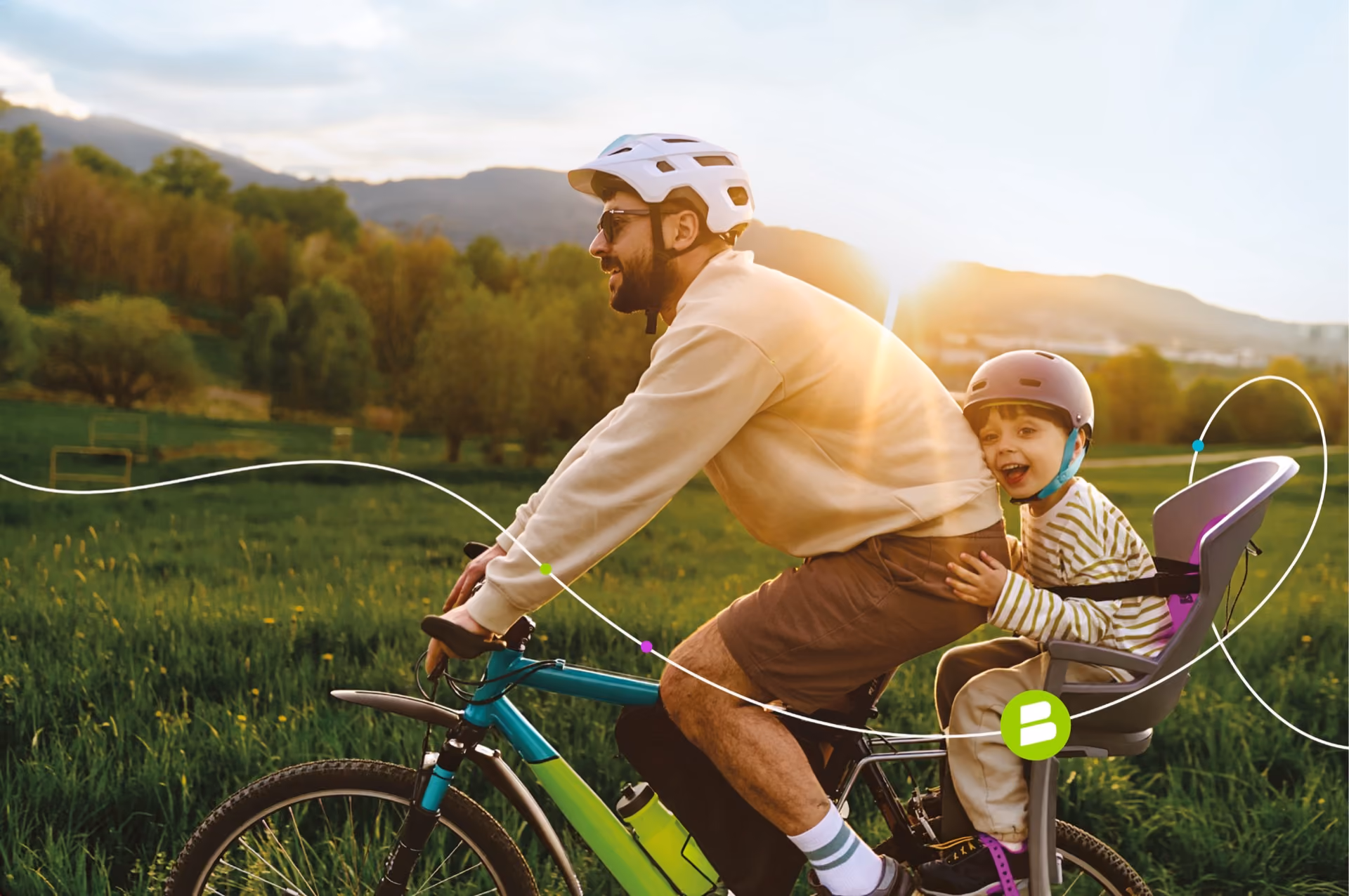 Man cycling through the countryside with a child in a rear bike seat